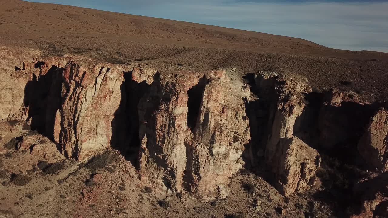 Patagonia, Argentina. Drone Aerial View of Desert Canyon and Salt Flat Under Golden Hour Sunlight