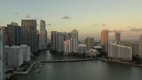 cinematic pan aerial shot of brickell key in miami florida at sunset during golden hour