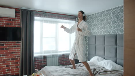 Man Dancing in Hotel Room