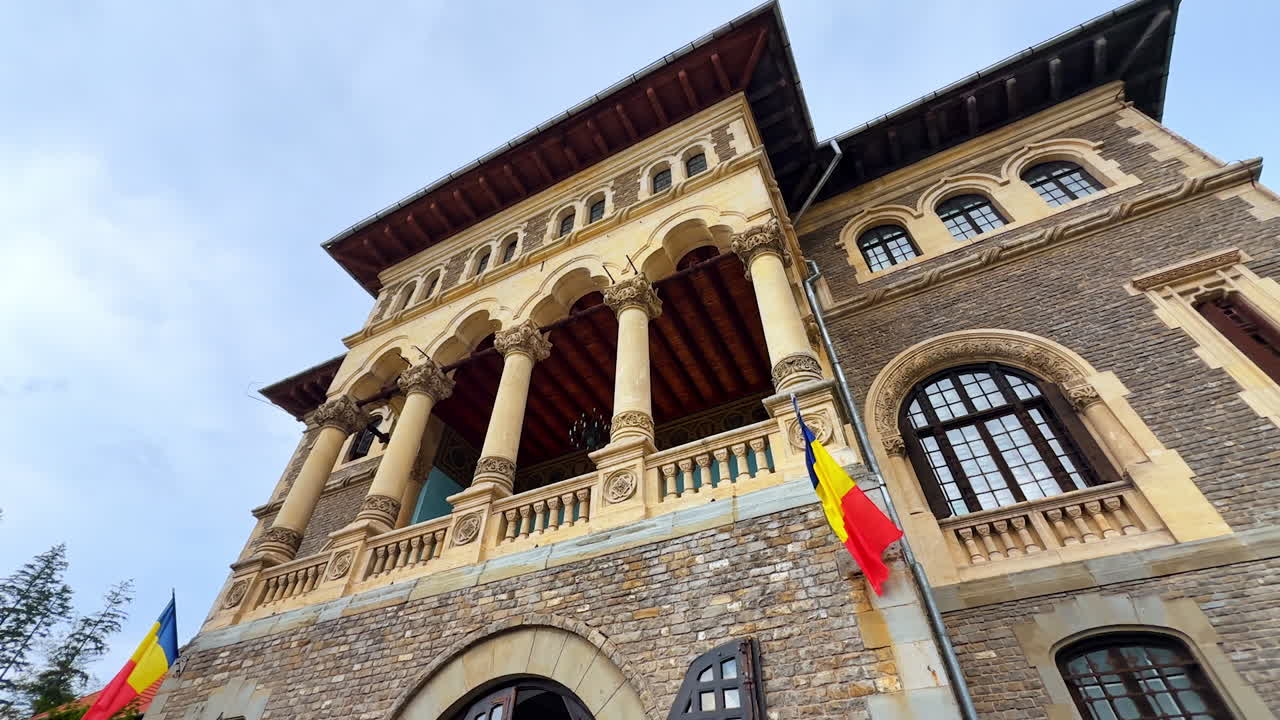 Stunning architecture of Cantacuzino Castle in Busteni, Romania. Famous landmark from low angle view on rainy day