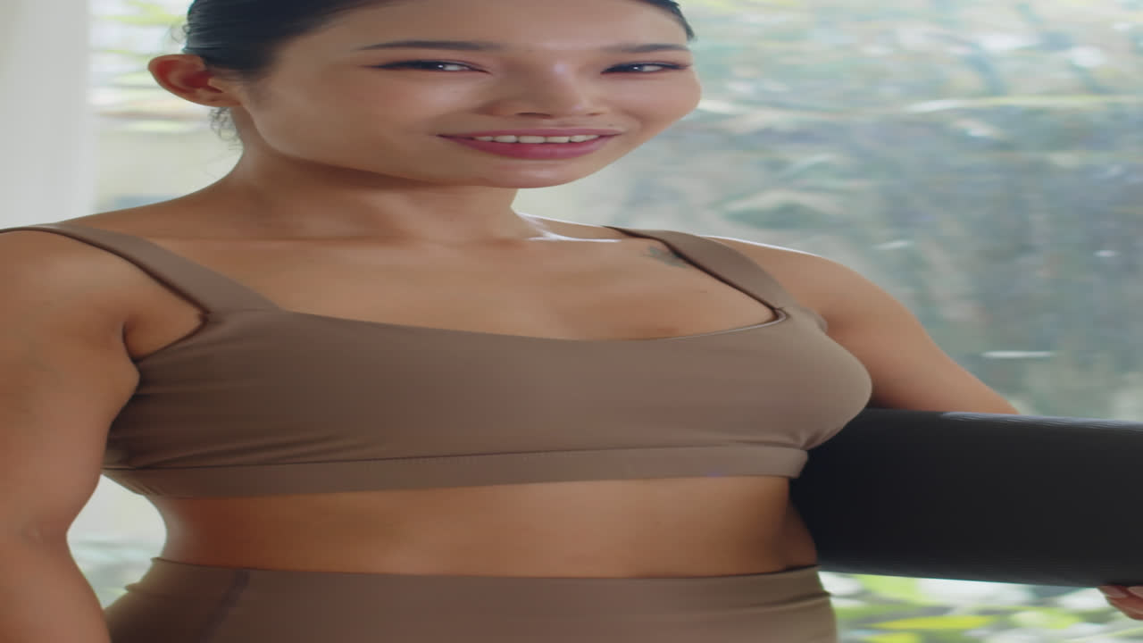 Portrait of Asian Sportswoman with Yoga Mat