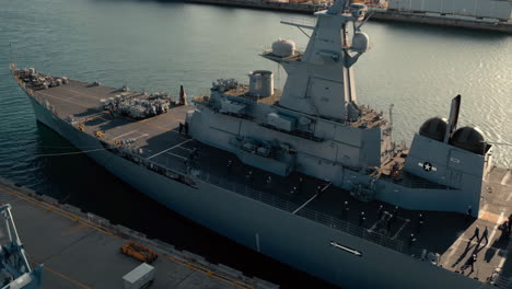 military warship docked in port