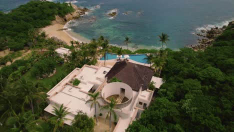 aerial view of tropical resort hotel beside beach in huatulco