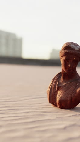 weathered stone bust of a woman on a rooftop