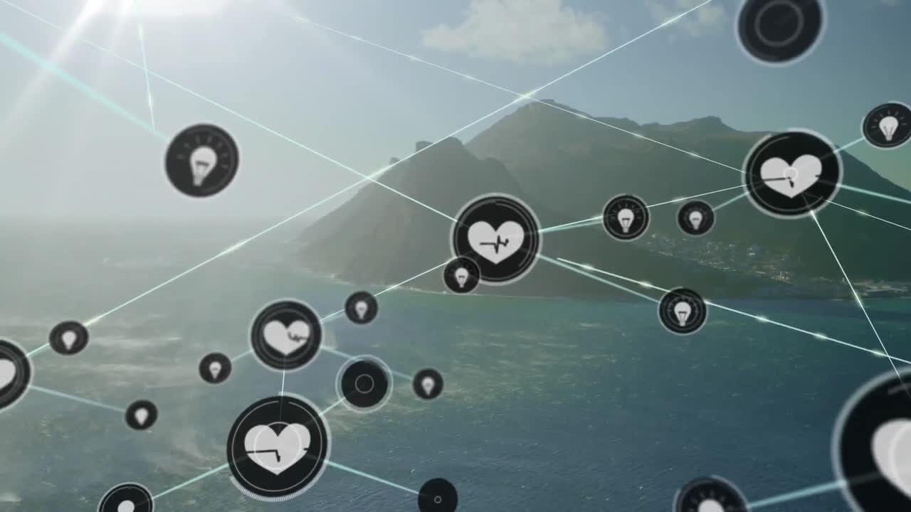 Animation of connected icons over aerial view of sea and mountains against cloudy sky