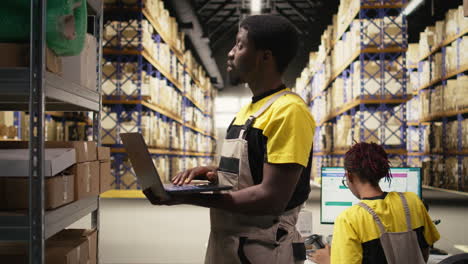 warehouse clerk inspecting boxes details on shelving units in distribution hub