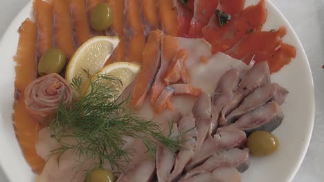 table is served with red fish and meat