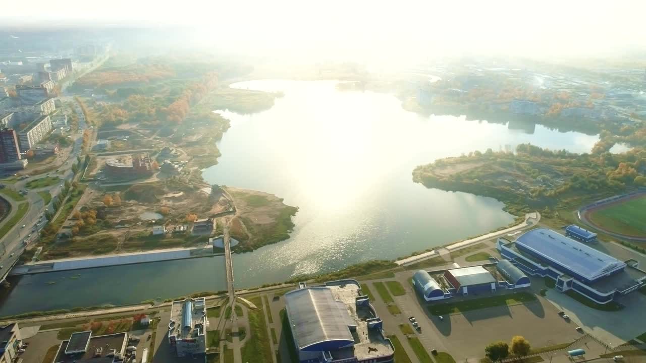 Aerial view of Yoshkar-Ola city on banks of river at sunny autumn day