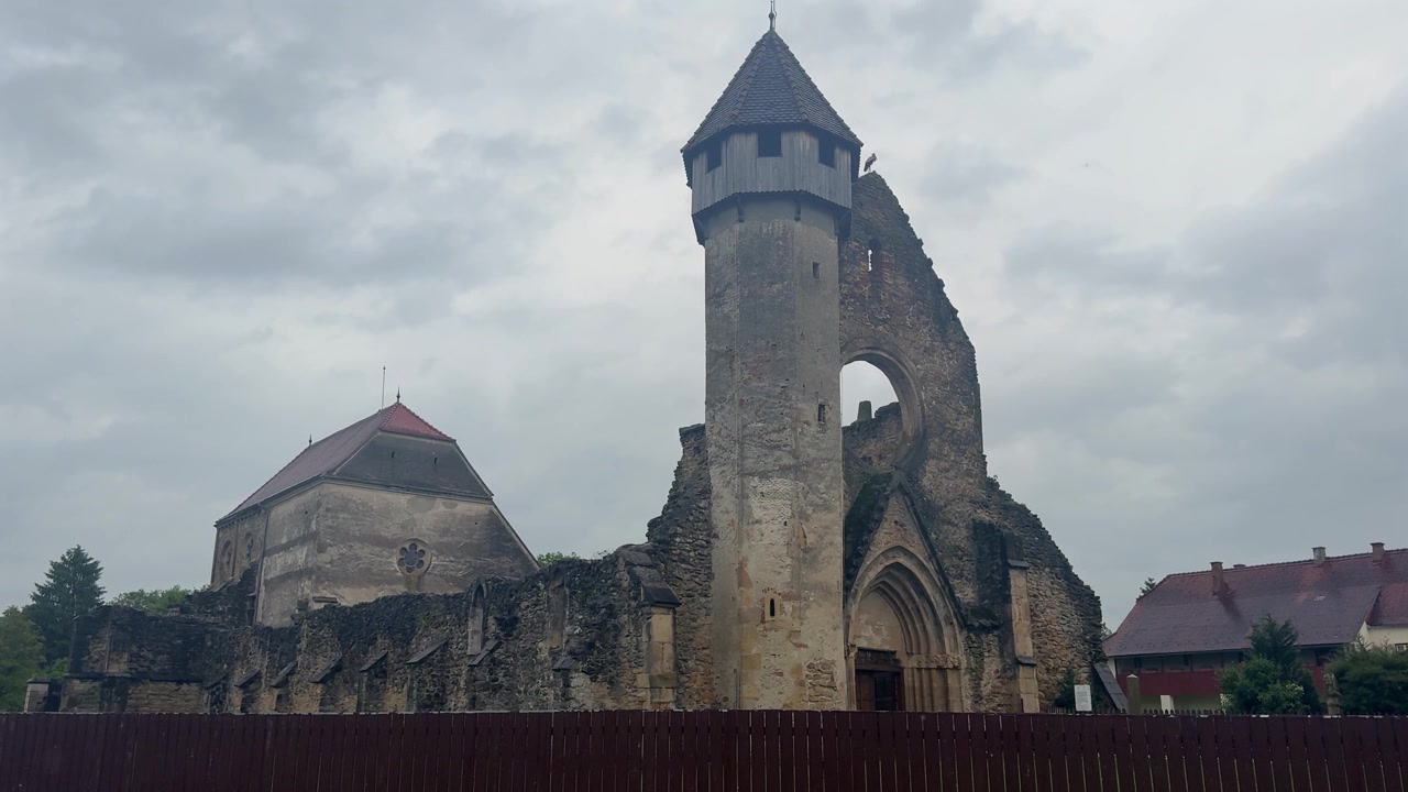 Medieval ruins of the Cistercian monastery of Carta in Transylvania, Romania. Historic stone building with a prominent bell tower