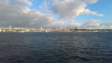 istanbul skyline with boats and a bridge in the foreground