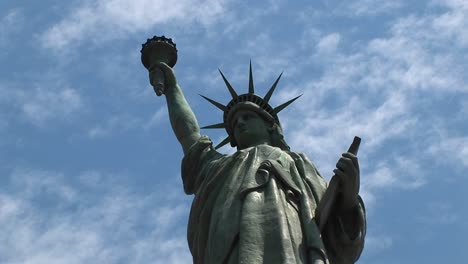 the camera pansleft across the statue of liberty