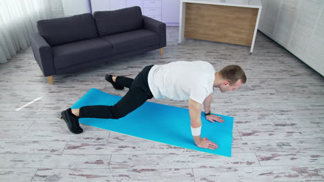 man doing exercises for leg. man doing exercisesfor leg at home on mat