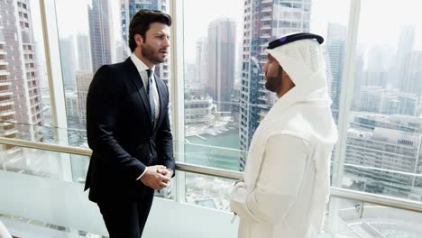 male multi ethnic business colleagues meeting city offices