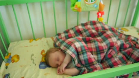 newborn child in crib