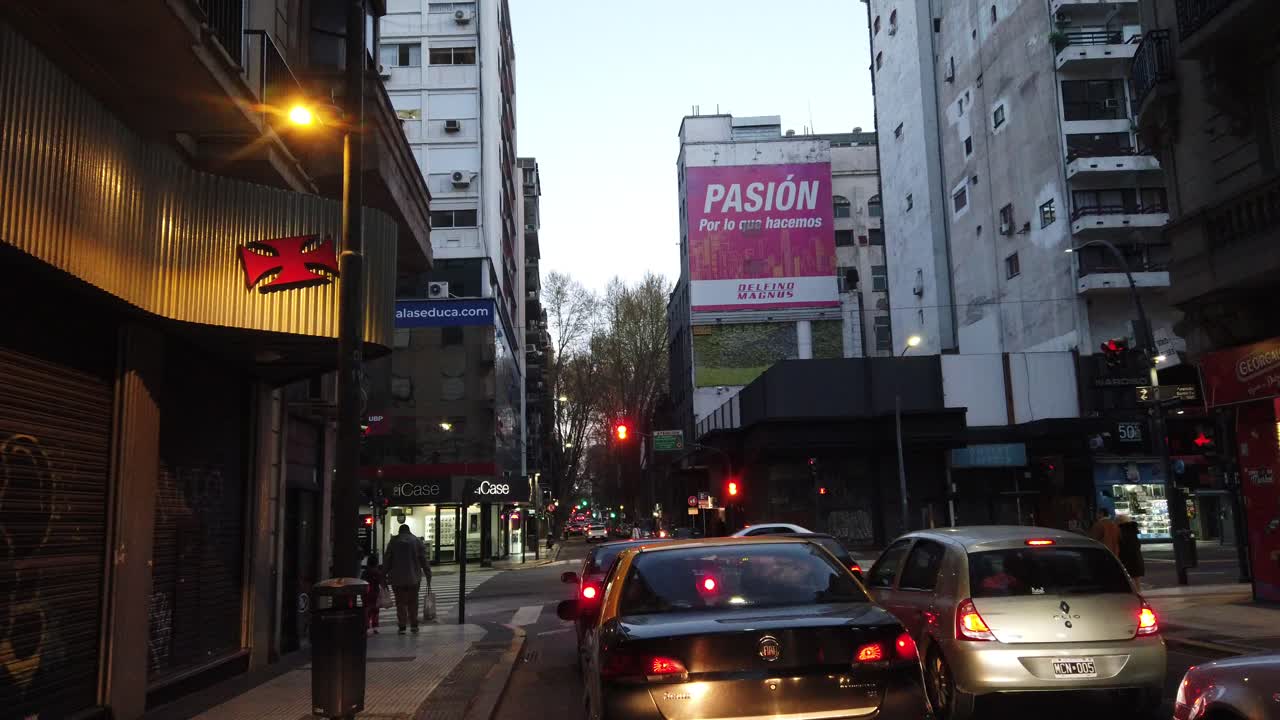 Nightdrive POV red lights at buenos aires city, Santa fé avenue at recoleta famous downtown design neighborhood