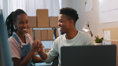 People,-high-five-and-computer-with-boxes