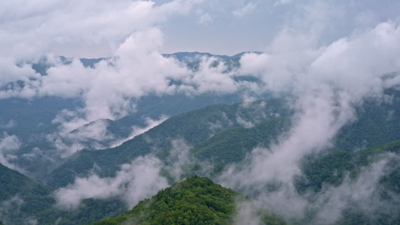 Gentle fog drapes the landscape in this drone view of the Smokies