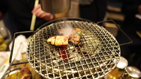 cooking meat on a rotating barbecue grill