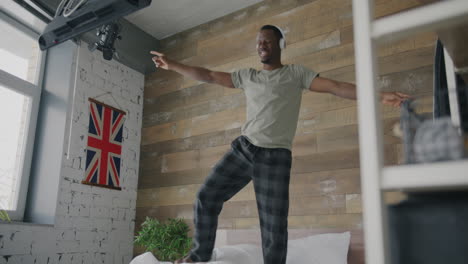 man dancing on bed