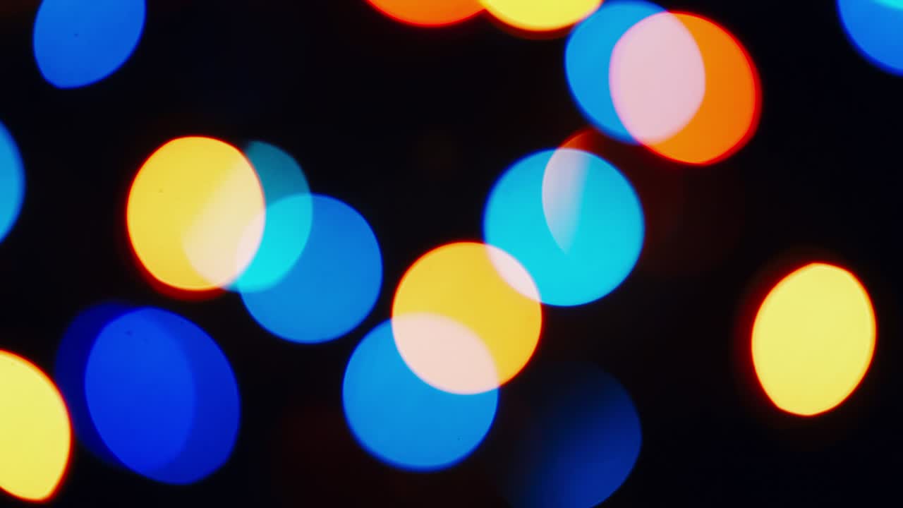 el fondo abstracto de las luces brillantes de navidad de bokeh circular.
