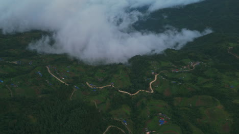 mesmerizing drone shot of dolakha village in nepal where clouds comes to meet the land, mystic serene landscape bird's-eye view captures tranquil environment and natural beauty landscape