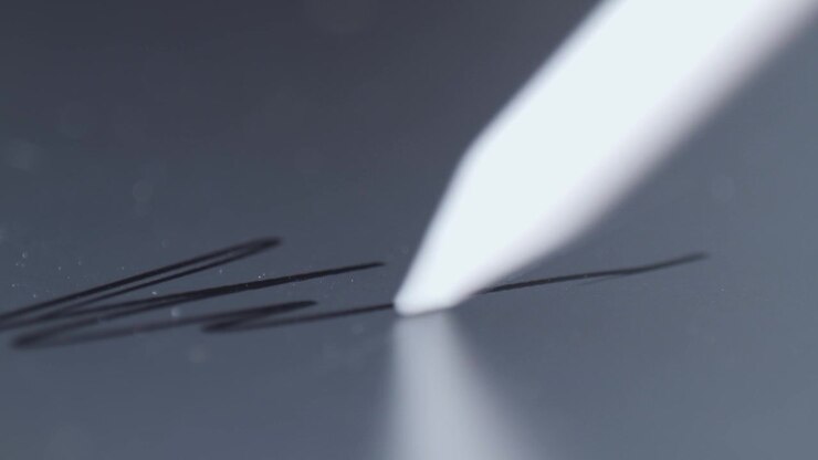 Stylus macro on tablet. painting Electronic Signature on Tablet Computer by Stylus in Male Hand. Sign Document of Deal on PC at Work in Office Indoors. Write Business Agreement for Entrepreneur.