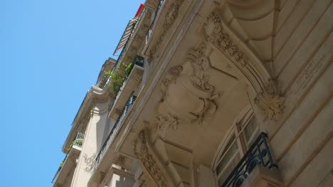 balcony architecture structure detail captured in low angle on old building in paris, france