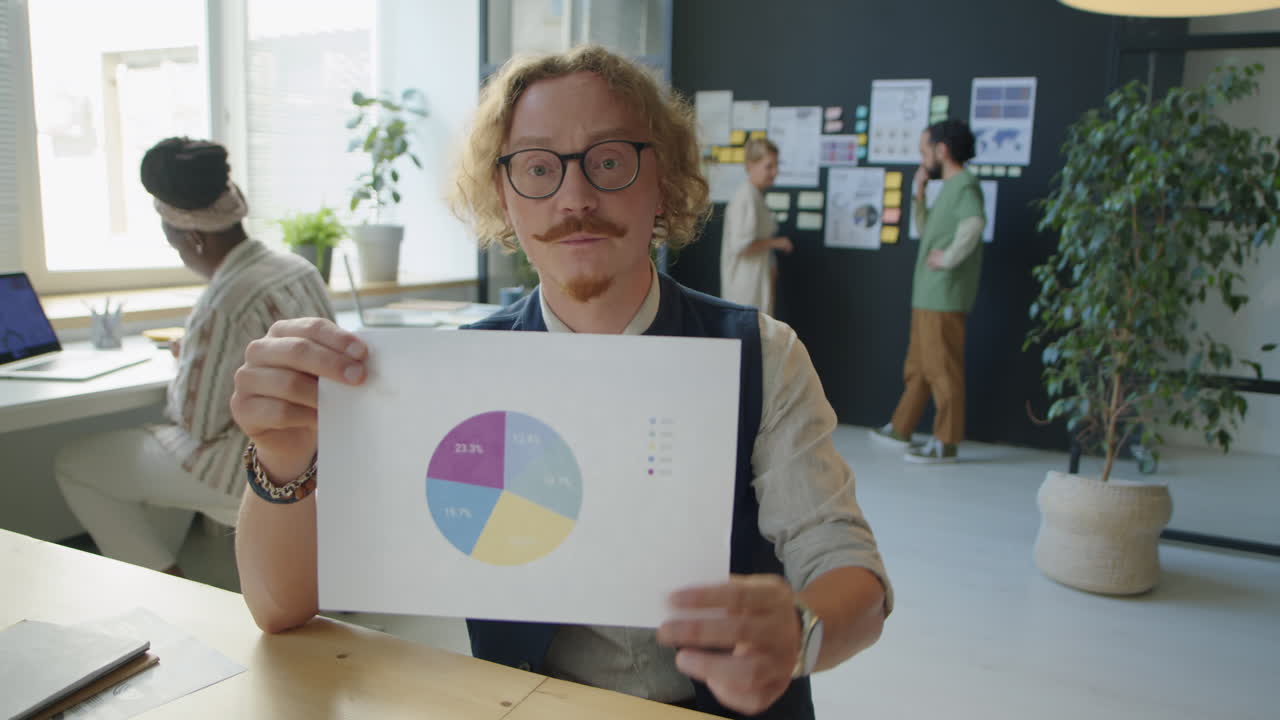 Businessman Discussing Chart on Video Call