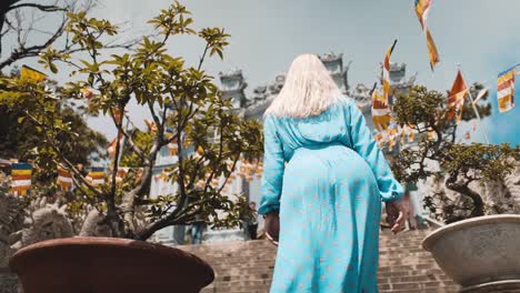 a girl is going upstairs at ba na hills, vietnam