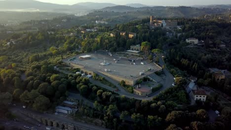 piazzale michelangelo in the south of florence italy with a statue of david replica and vistas of the city, arno river and san niccolo tower, aerial flyover shot