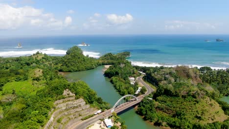 scenic coastal road and bajulmati bridge and shore of east java indonesia aerial