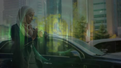 Animation-of-neon-round-scanner-against-woman-in-hijab-using-smartwatch-on-the-street