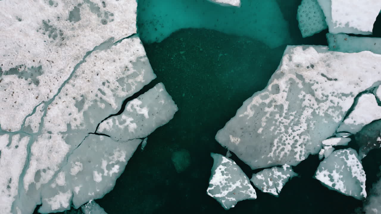 Broken Ice and Teal Water