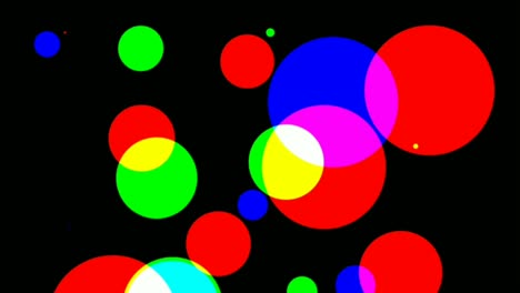 graphic effect of flashing colored circles on black background