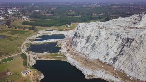 aerial shot of stone quarry with white limestones rocks in hyderabad, india