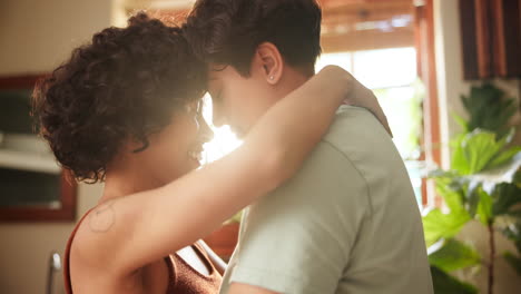 happy couple hugging in a kitchen