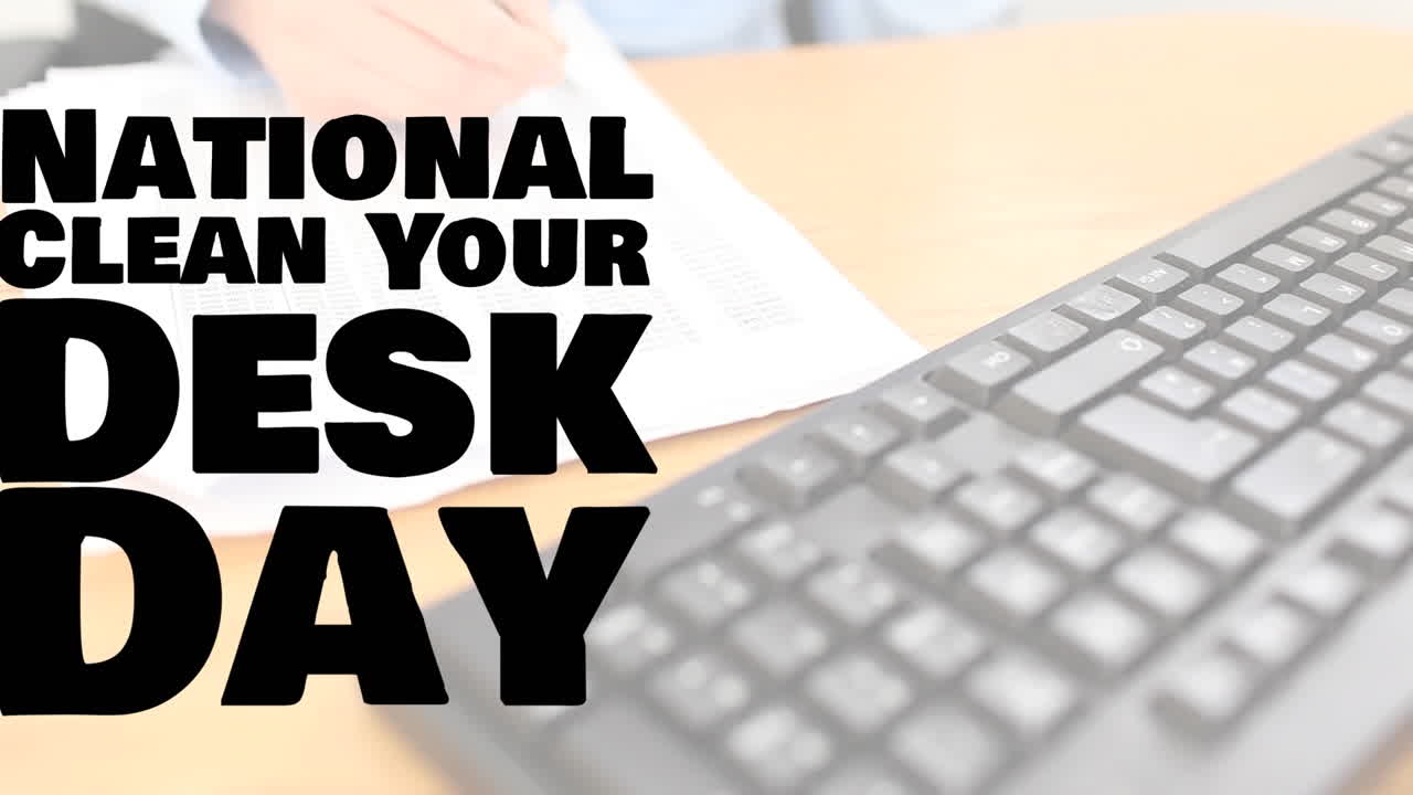 Animation of national clean your desk day text over hand of caucasian businesswoman writing