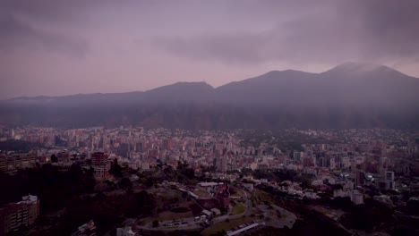 aerial view of a sunrise over caracas city, venezuela, with the avila mountain in the background.