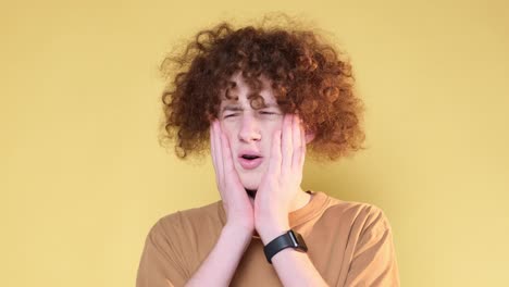 negative emotions on the camera of a young man a student with curly hair the emotion of disgust negative emotions on the camera of a young man a student with curly hair the emotion of disgust revulsion