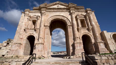 still shot of arch of hadrian in city of jerash on a bright and sunny day