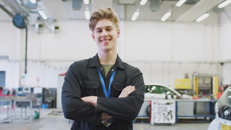 portrait of male student studying for auto mechanic apprenticeship at college