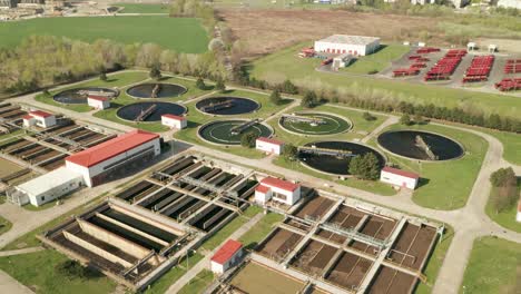 aerial crane shot of sewage treatment plant-waste water treatment facility. camera moving up.