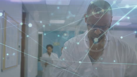 the video features a scientist using a digital tablet in their office