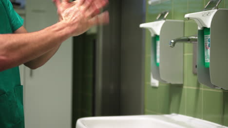 surgeon disinfects his hands several times and thoroughly, doctor in hospital