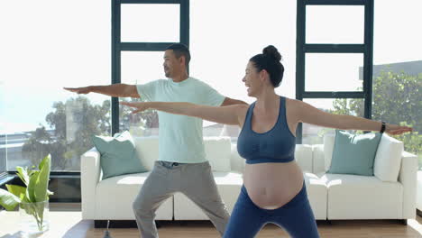 exercising together, pregnant woman and man doing yoga in living room