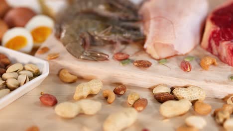 variety of protein-rich foods on wooden board