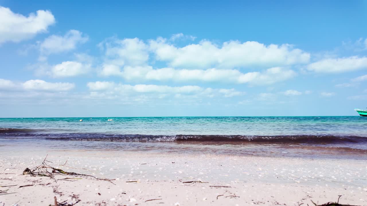 Sunset view over the beach at Holbox, Punta Cocos, Mexico, showcasing calm waters