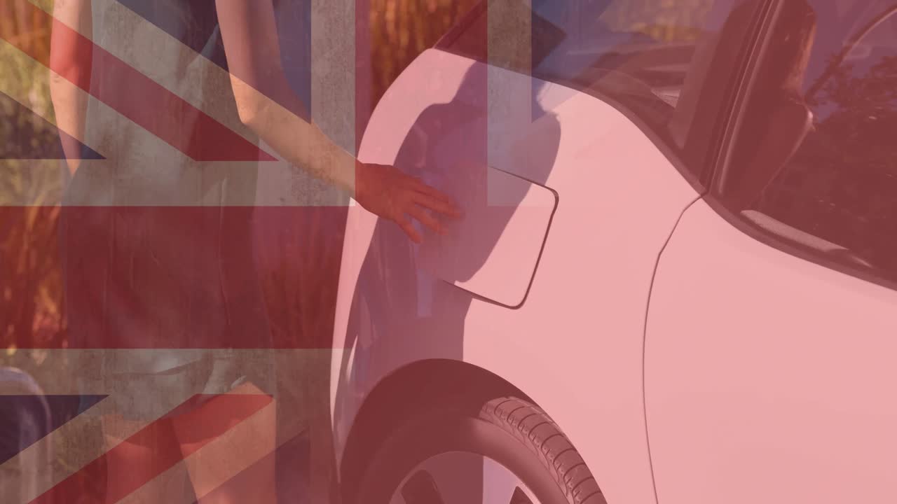 전기 자동차를 충전하는 여성 위에 영국  ⁇ 발