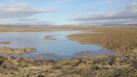Landscape-View-Of-Wetlands-In-Winter-Under-Blue-Cloudy-Sky-At-Olfusa-River-Near-Selfoss-Town-In-South-Iceland
