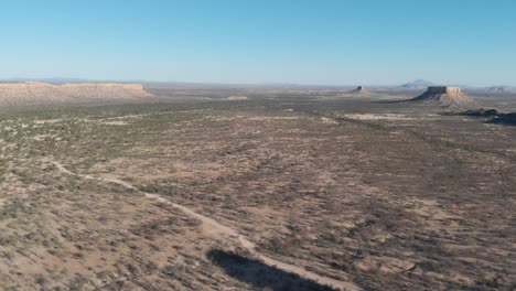 high altitude drone aerial video footage of impressive rock formation vingerklip, namibia, africa. tall stone monument in african desert. monument valley look alike. vast namibian outback.